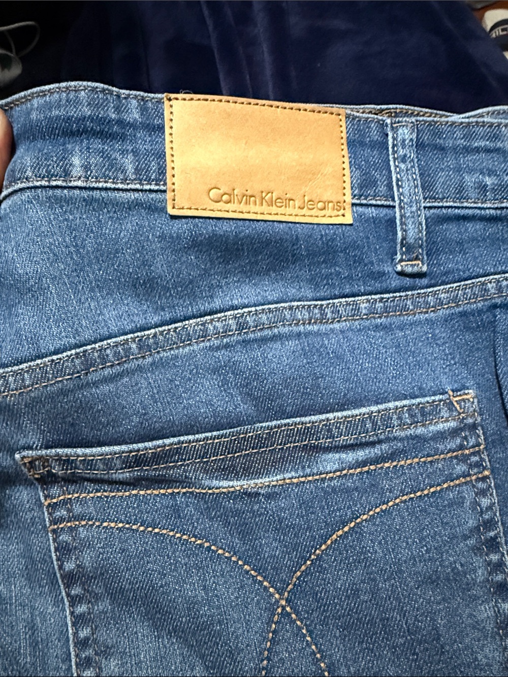 Calvin Klein Jeans Medium Blue Denim with Tan Leather Patch